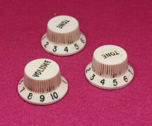 Load image into Gallery viewer, Original Fender Aged Parchment Knobs with Green Font for Fender® Stratocaster
