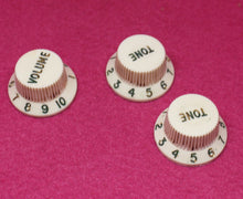 Load image into Gallery viewer, Original Fender Aged Parchment Knobs with Green Font for Fender® Stratocaster
