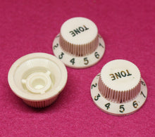 Load image into Gallery viewer, Original Fender Aged Parchment Knobs with Green Font for Fender® Stratocaster
