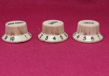 Load image into Gallery viewer, Original Fender Aged Parchment Knobs with Green Font for Fender® Stratocaster
