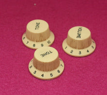 Load image into Gallery viewer, Aged Cream Ivory Knobs Set with Green Small Font for Fender® Stratocaster
